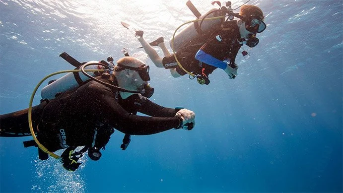 Dive instructor supervising child during Discover Scuba Course