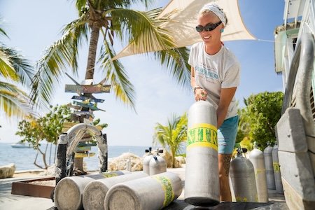 Scuba diver preparing Nitrox cylinders