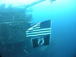 American and POW/MIA flags on the dive site USS Oriskany